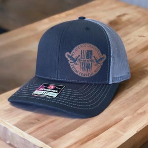 We Are Not Descended Leatherette Hat Patch With Adhesive Backing