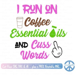 May include: A graphic design with the text "I RUN ON Coffee Essential Oils AND Cuss Words". The design includes a coffee cup, essential oil bottle, and a hand gesture. The text is in various colors.