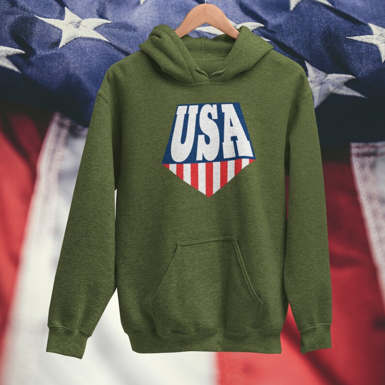 May include: A green hooded sweatshirt with a white "USA" graphic in a diamond shape with red and blue stripes.
