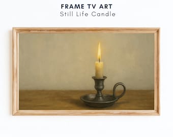 May include: A framed digital art print titled "Still Life Candle." The artwork depicts a lit candle in a pewter candlestick holder on a wooden surface. The background is a muted beige, and the frame is light brown.