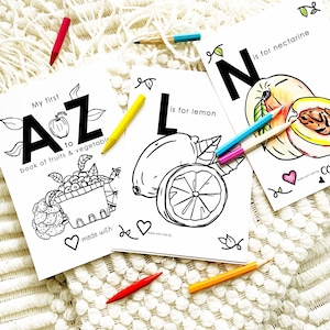 May include: Three black and white coloring pages featuring the letters A, L, and N. Each page has a different fruit, an apple, a lemon, and a nectarine, and the text "My first A to Z book of fruits & vegetables" and "is for lemon" and "is for nectarine".