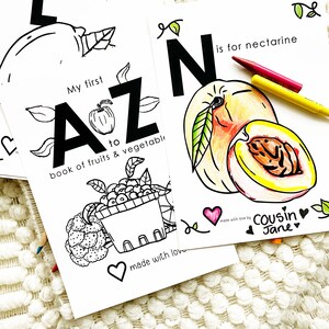 May include: Black and white printable coloring pages for a book of fruits and vegetables. The pages feature the letters A and N, with illustrations of an apple and a nectarine. The text "My first A to Z book of fruits & vegetables" and "N is for nectarine" are included on the pages.