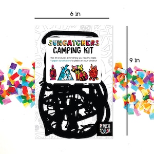 May include: A camping themed suncatcher kit with four designs: a lantern, a mountain, a raccoon, and a campfire. The kit includes everything you need to make four paper suncatchers, measuring 6 inches by 9 inches.