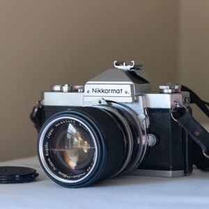 Nikon Nikkormat FTN w/ Zoom-Nikkor 43-86mm f3.5: SLR 35mm film camera with fast zoom lens, operating meter