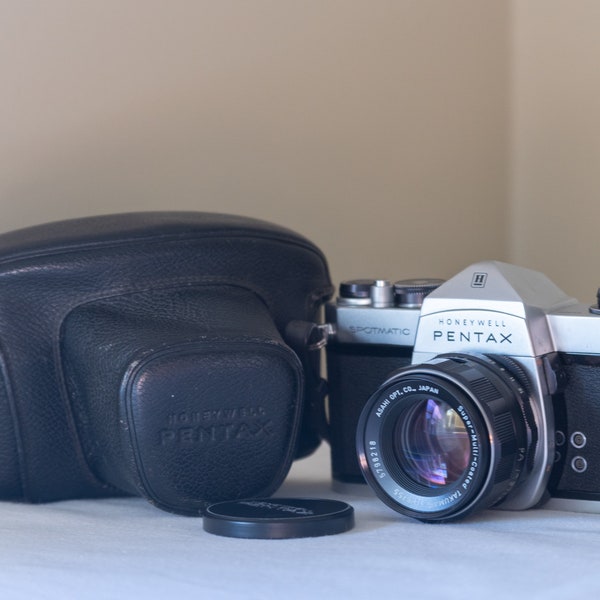 Pentax Spotmatic w/ SMC Takumar 55mm f1.8: SLR 35mm film camera with fast prime lens, operating meter, and strap