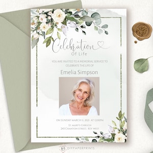 May include: A white and green floral memorial service announcement with a photo of a woman. The announcement reads "Celebration of Life" and includes the name "Emelia Simpson". The announcement also includes the date, time, and location of the service.