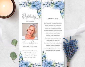 May include: A blue floral bookmark with a photo of a woman and the text "Celebrating the Life of Simone Adamson July 15, 1959 - March 11, 2023" and a poem titled "A Silent Tear".