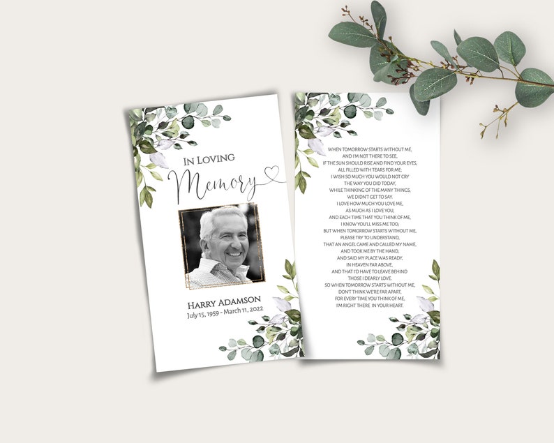 May include: A white and green floral sympathy card with a black and white photo of a man. The card reads "In Loving Memory" and "Harry Adamson, July 15, 1959 - March 11, 2022". The back of the card has a poem about remembering someone who has passed away.