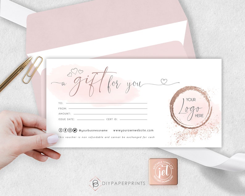 May include: A pink and white gift certificate template with a watercolor background and a gold circle with the text "YOUR LOGO HERE". The text "a gift for you" is written in cursive with hearts.