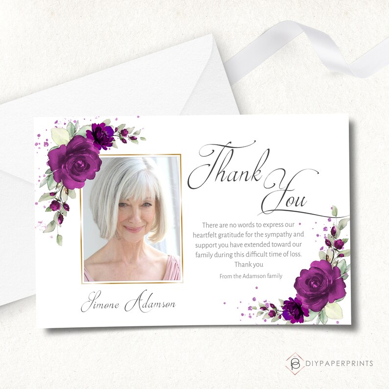 May include: Thank you card with a purple floral design and a photo of a woman. The card reads "Thank You" and includes the text "There are no words to express our heartfelt gratitude for the sympathy and support you have extended toward our family during this difficult time of loss. Thank you. From the Adamson family."