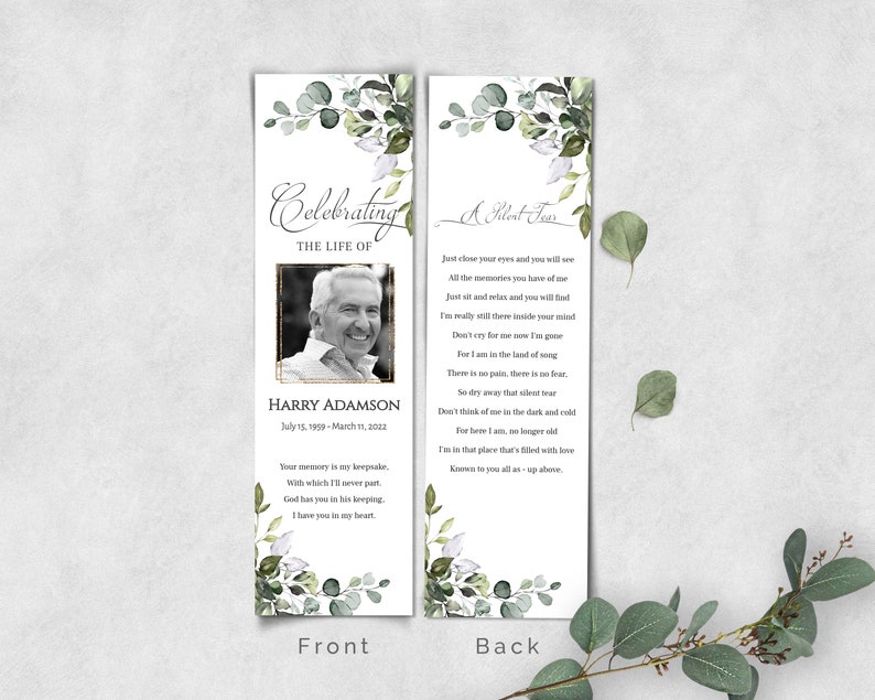 May include: A white bookmark with a green floral design and a photo of a man. The text "Celebrating the Life of" and "Harry Adamson" is printed on the front. The back of the bookmark has a poem titled "A Silent Tear".