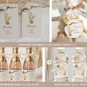 May include: A collection of baby shower party supplies featuring a Winnie the Pooh theme. Includes favor tags, champagne/wine labels, bottle labels, and a bag of cookies with a round sticker. The tags say "thanks" and "Love Olivia".