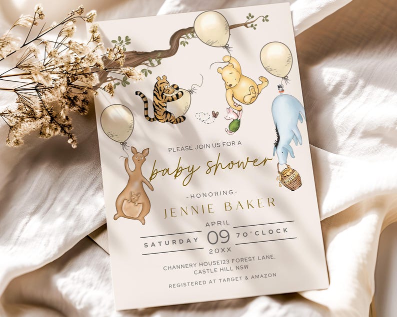 May include: A baby shower invitation with illustrations of Winnie the Pooh characters, balloons, and a tree branch. The invitation text reads "Please join us for a baby shower" and includes the honoree's name, date, and location.