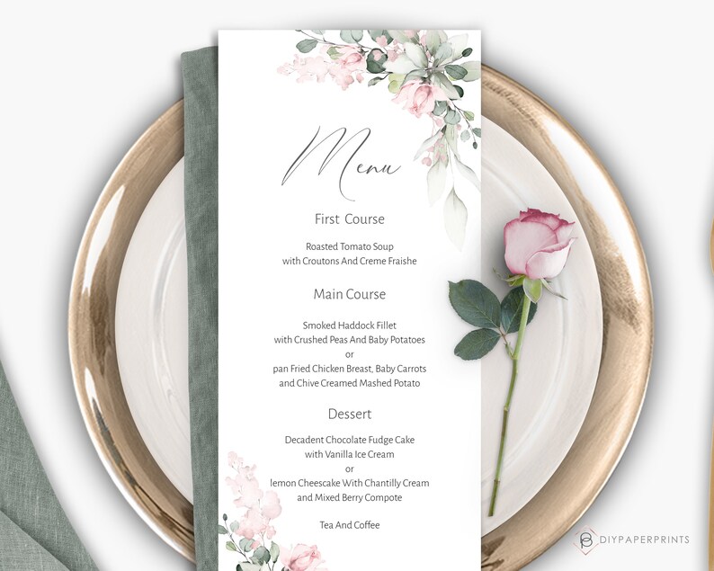 May include: A printable wedding menu template with a watercolor floral design in shades of pink and green. The menu features a three-course meal with options for each course: Roasted Tomato Soup, Smoked Haddock Fillet or pan Fried Chicken Breast, and Decadent Chocolate Fudge Cake or lemon Cheesecake.
