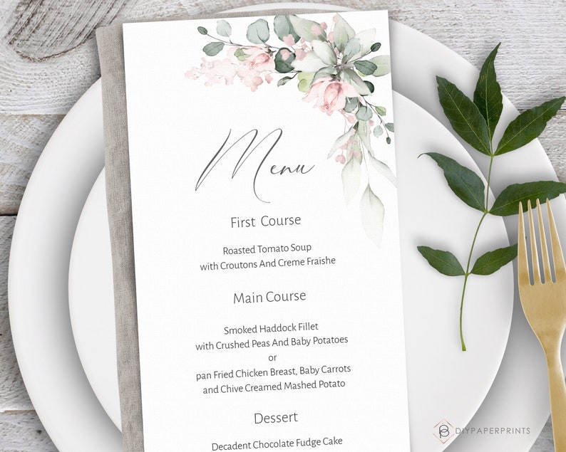 May include: A white menu card with a floral design in shades of pink and green. The menu lists the courses: First Course, Main Course, and Dessert. The text on the menu includes: Roasted Tomato Soup, Smoked Haddock Fillet, pan Fried Chicken Breast, and Decadent Chocolate Fudge Cake.