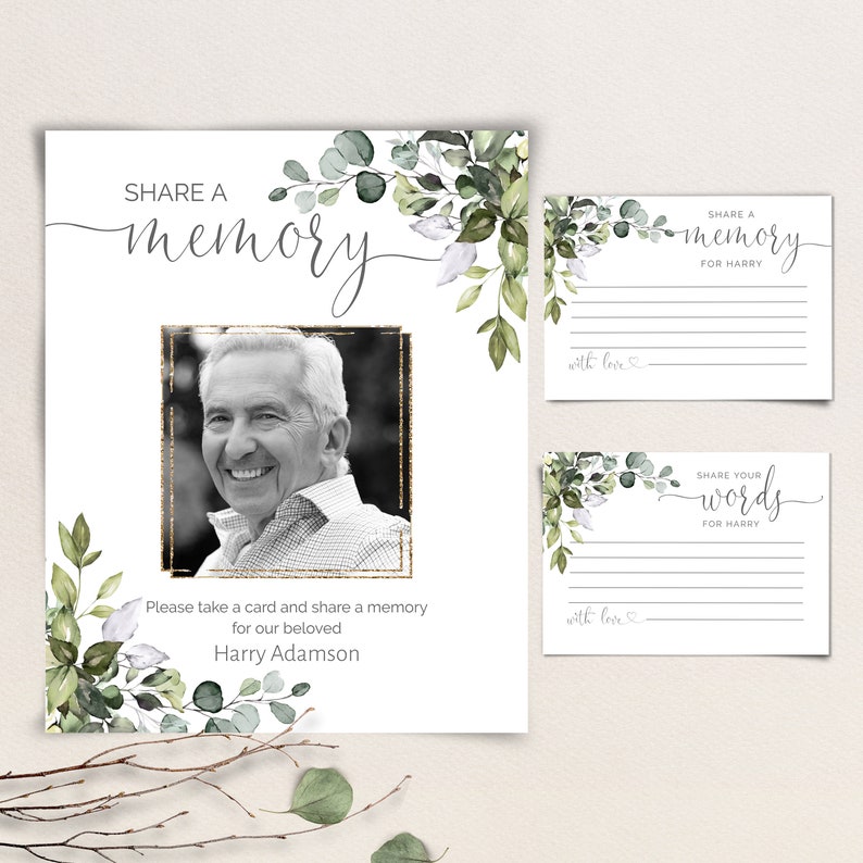 May include: A white card with a black and white photo of a man, green foliage, and gold glitter. The card says "Share a memory" and "Please take a card and share a memory for our beloved Harry Adamson". There are two smaller cards with the text "Share a memory for Harry" and "Share your words for Harry".