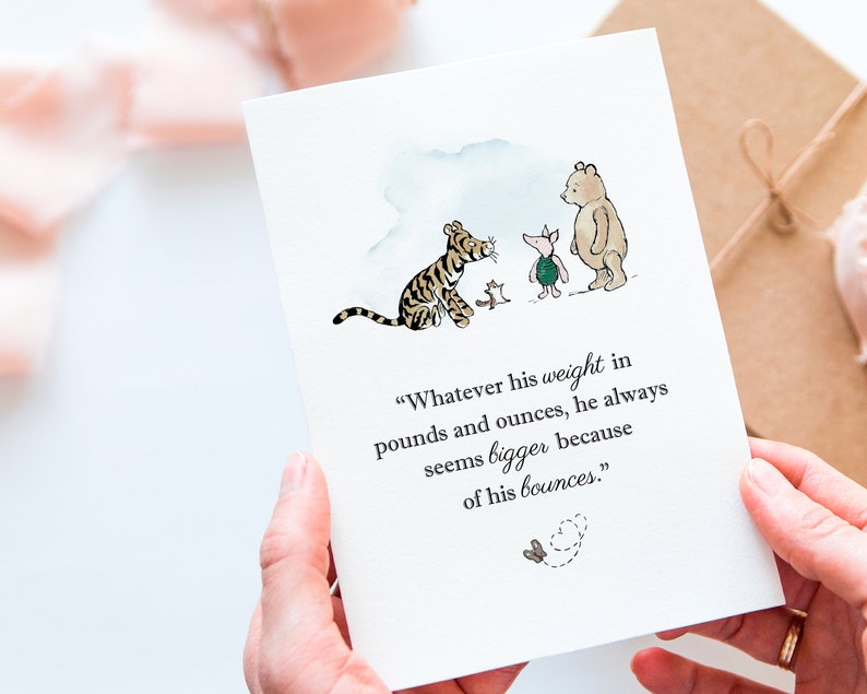 May include: A greeting card featuring a watercolor illustration of Winnie the Pooh characters. The card includes a quote about weight and bounces. The characters include a tiger, piglet, bear, and a small butterfly.