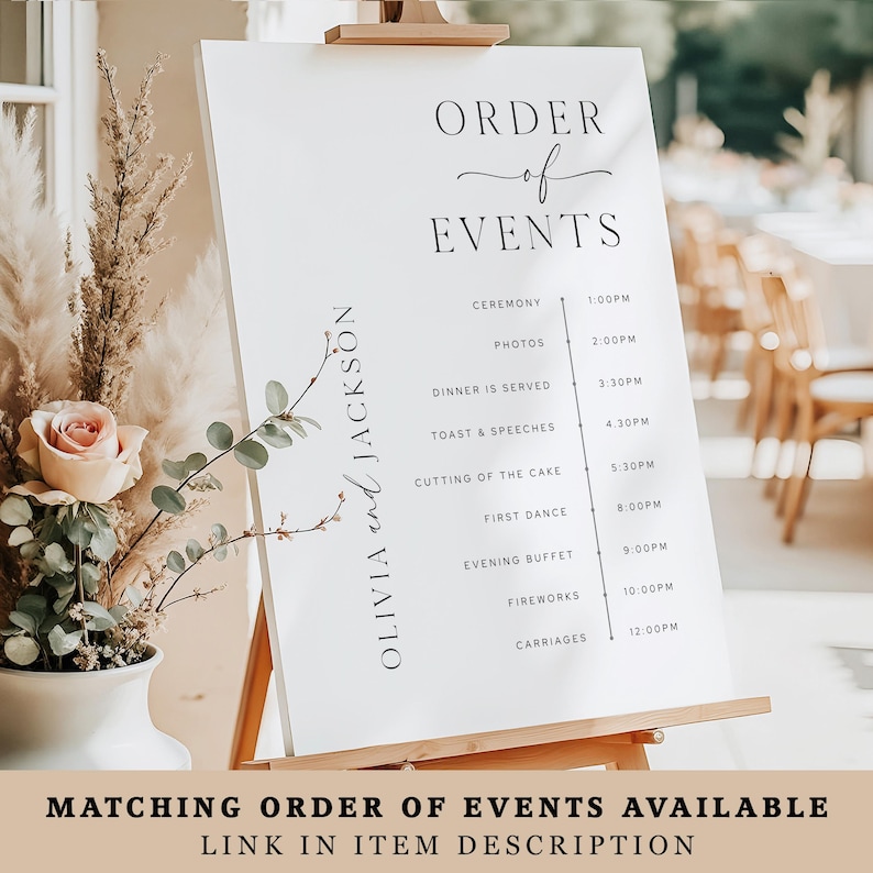May include: A white wedding event sign on a wooden easel displays the order of events. The sign features elegant black text, including the names "Olivia and Jackson" and a detailed schedule with times for the ceremony, photos, dinner, and more. The bottom of the sign reads "MATCHING ORDER OF EVENTS AVAILABLE".