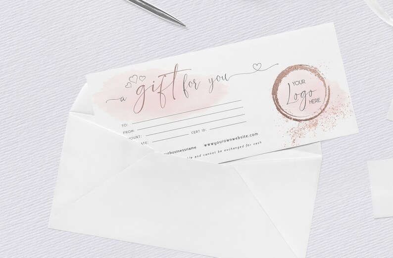 May include: A white gift certificate with a pink watercolor background and the text "a gift for you". The certificate has lines for the recipient's name, the amount of the gift, and the date. The certificate also has a space for a logo and the website address "www.yourownwebsite.com".