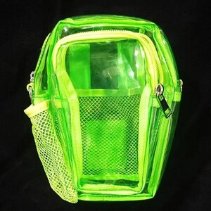 May include: A neon green transparent crossbody bag with a zippered main compartment and a front mesh pocket. The bag has a yellow zipper and a matching yellow mesh pocket. The bag is made of a clear, see-through material.
