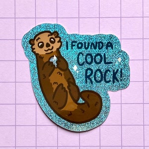 Otter with a rock holographic glitter sticker