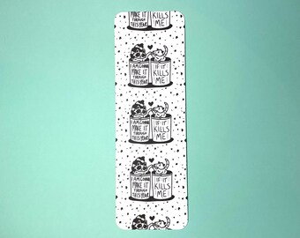 May include: Black and white bookmark with a repeating pattern of two raccoons in cans. The raccoons are holding hearts and the cans have the text "I am gonna make it through this year" and "If it kills me".