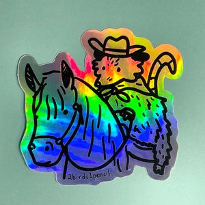 Holographic cowboy possum sticker