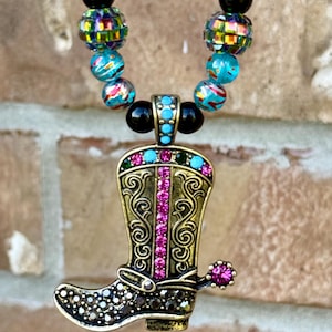 May include: A set of three ceramic mugs with a speckled, matte finish. The mugs are in shades of cream, light gray, and dark gray. Each mug has a simple, minimalist design and a rounded handle.