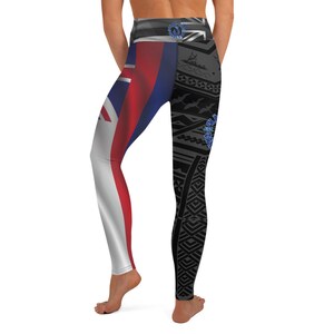 May include: High-waisted leggings featuring a split design. One leg displays the Hawaiian flag, while the other showcases a black and gray tribal pattern with blue accents. The leggings are designed for athletic activities.