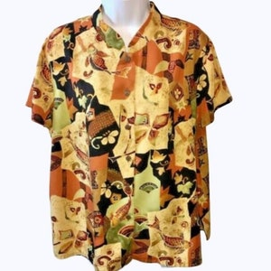 May include: A short-sleeved button-up shirt with a colorful abstract print featuring geometric shapes, birds, and floral designs in shades of orange, brown, black, and green.