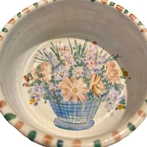 May include: A white ceramic mug with a black handle and the text "But First, Coffee" in a bold, black font. The mug is set against a neutral background, highlighting its simple design.