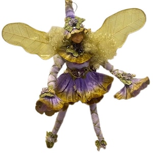 Figura de hada coleccionable de Mark Roberts con detalles increíbles en amarillo, morado y lavanda