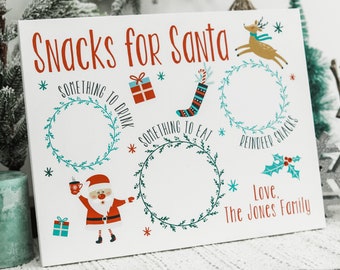 May include: White sign with the text "Snacks for Santa" and three wreaths with spaces for treats. The wreaths are labeled "Something to Drink", "Something to Eat", and "Reindeer Snacks". There is a cartoon Santa Claus holding a cup and a reindeer flying in the top right corner. The sign is signed "Love, The Jones Family".