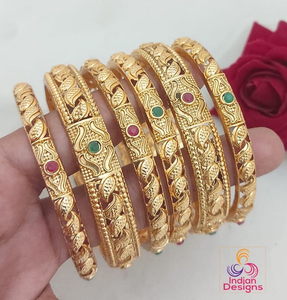 New bangles designs  New gold jewellery designs, Gold bangle set