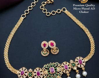 South indian gold choker necklace designs| small gold choker necklace designs with pearl drops and ad stones| american diamond necklace