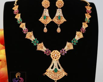 Gold plated ad stone floral necklace and earrings| indian jewelry| american diamond matte gold necklace| temple style cz ruby green jewelry