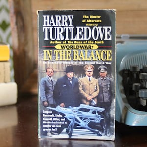 May include: A book cover with the title "Worldwar: In the Balance" by Harry Turtledove. The cover features a photo of four men in military uniforms, including Winston Churchill, Franklin D. Roosevelt, Joseph Stalin, and Adolf Hitler.