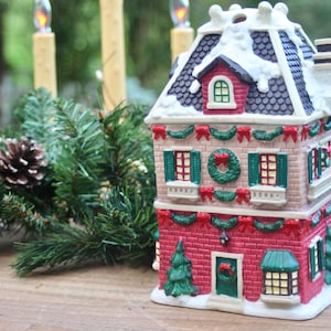 Vintage Christmas Village Three-Story Inn, 2 Piece Canister, Ceramic Inn with Winter Snow, Wreaths, Garland, and Cobblestone Chimney