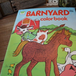 May include: A vintage coloring book with a red barn, a brown horse, a cow, a rooster, and two yellow chicks. The book is titled "BARNYARD color book" and costs 69 cents.