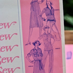 May include: A vintage sewing pattern featuring four different views of a dress. The pattern is printed on pink paper with purple illustrations. The pattern includes instructions for making a dress with a collar, pockets, and a belt. The pattern is titled "Sew" and includes the price of $3.00 USD and $3.30 CAD.