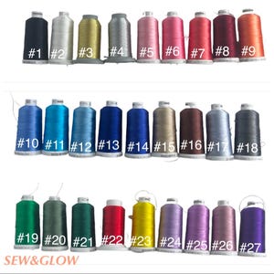 May include: Twenty-seven spools of thread in various colors, including black, silver, gold, pink, red, blue, green, yellow, purple, and brown. The spools are arranged in three rows of nine. Each spool has a number printed on it, from 1 to 27. The text 'SEW&GLOW' is printed at the bottom of the image.
