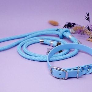 May include: A light blue rope dog lead and matching collar with silver hardware.