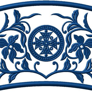 May include: A blue embroidered design featuring floral and cross motifs. The design is framed by a blue border and includes stylized flowers, leaves, and a central cross within a circular emblem. The overall shape is a fan or arch.