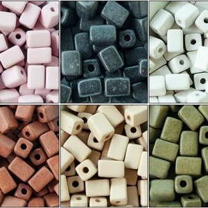 May include: Assortment of six colors of ceramic rectangular beads with a hole in the center. The colors are pink, black, white, brown, beige, and green.