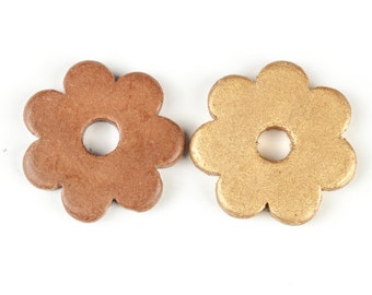 Large ceramic flower pendant in beige or brown with hole in the middle, can be used as charm or in various decoration projects