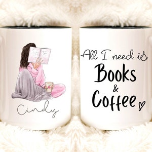 May include: White ceramic mug with a black handle and rim. The mug features an illustration of a person reading a book, with the name "Cindy" below. The text "All I need is Books & Coffee" is on the other side. A cozy gift for book lovers.