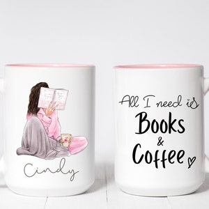 May include: White ceramic mug with a pink interior and handle. One side features an illustration of a person reading, the name "Cindy" is written below. The other side says "All I need is Books & Coffee" in black script.