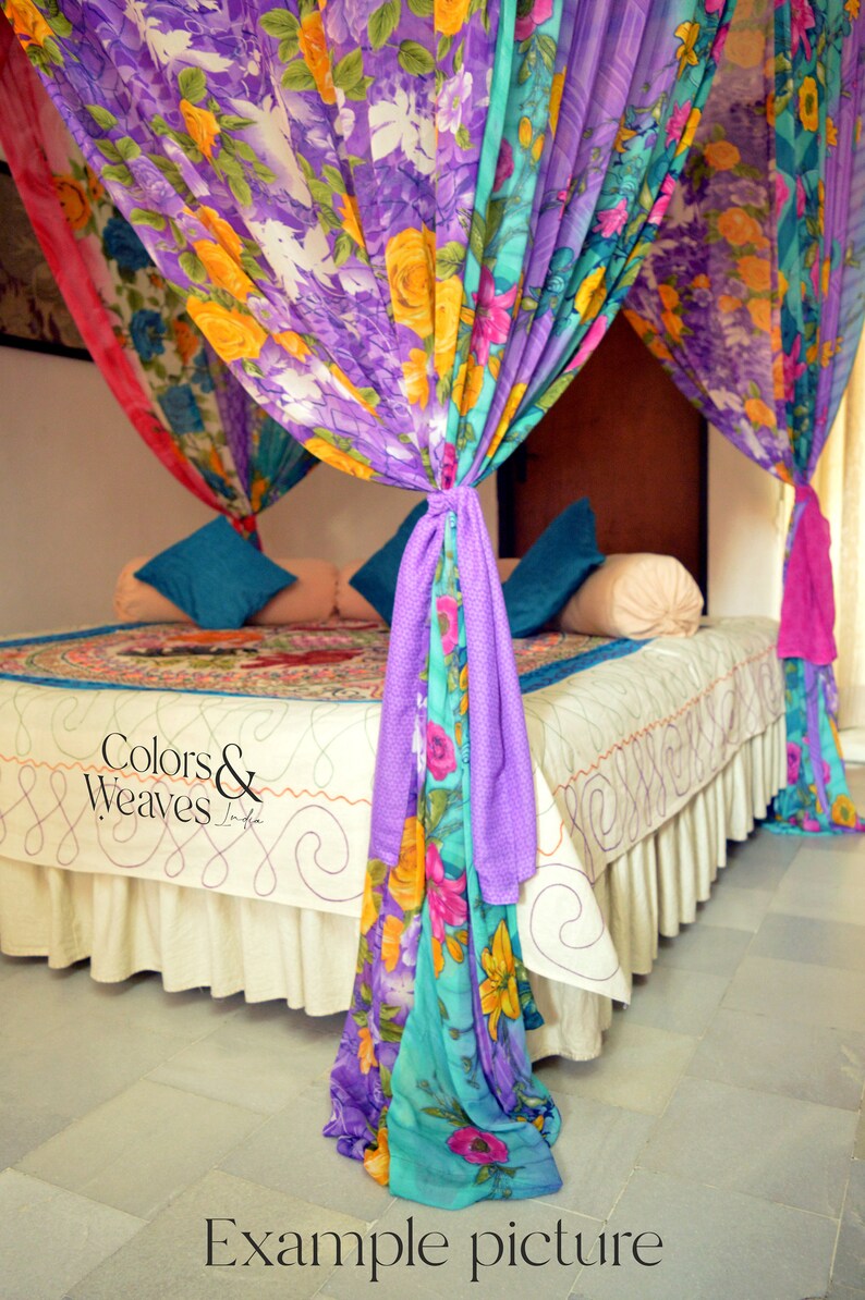 May include: A bed with a white sheet and a colorful floral patterned canopy. The canopy is made of multiple layers of fabric in shades of purple, pink, blue, and yellow. The text "Colors & Weaves" is visible on the bedspread.