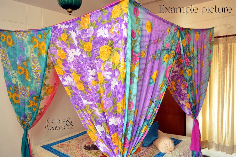 May include: A colorful floral canopy made from fabric, draped over a bed. The canopy is made of four panels of fabric, each with a different floral pattern. The fabric is sheer and lightweight, and the canopy is tied to the ceiling with ropes. The bed is made with a patterned bedspread and pillows. The text "Colors & Weaves" is visible in the image.
