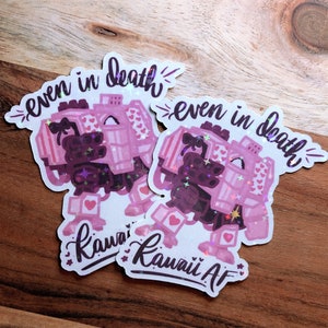 May include: Two pink and white stickers with a cartoon robot and the text "even in death" and "Kawaii AF".
